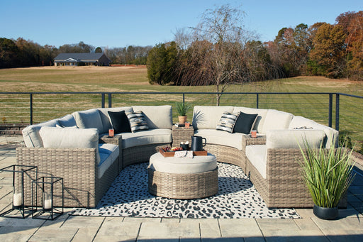 Calworth Outdoor 9-Piece Sectional with Ottoman JR Furniture Store